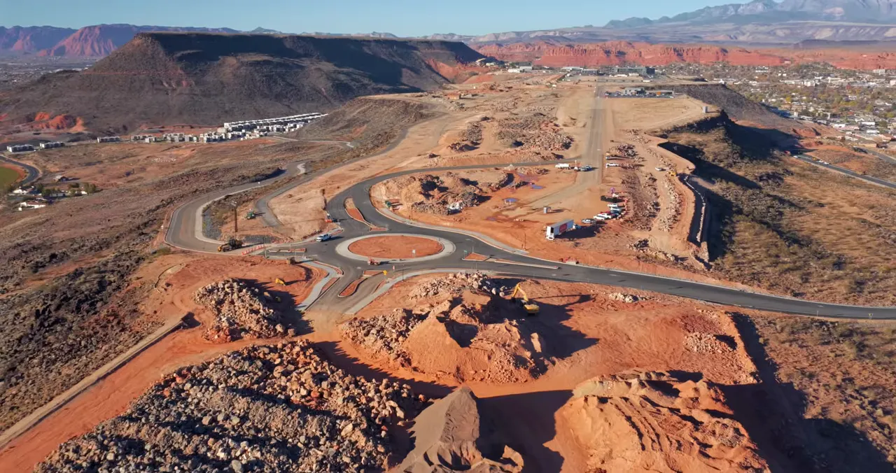 Wide aerial shot of the Tech Ridge roundabout and graded areas for the planned spine road.